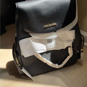 Michael Kors Black Backpack with Gold Hardware and Monogram Design
